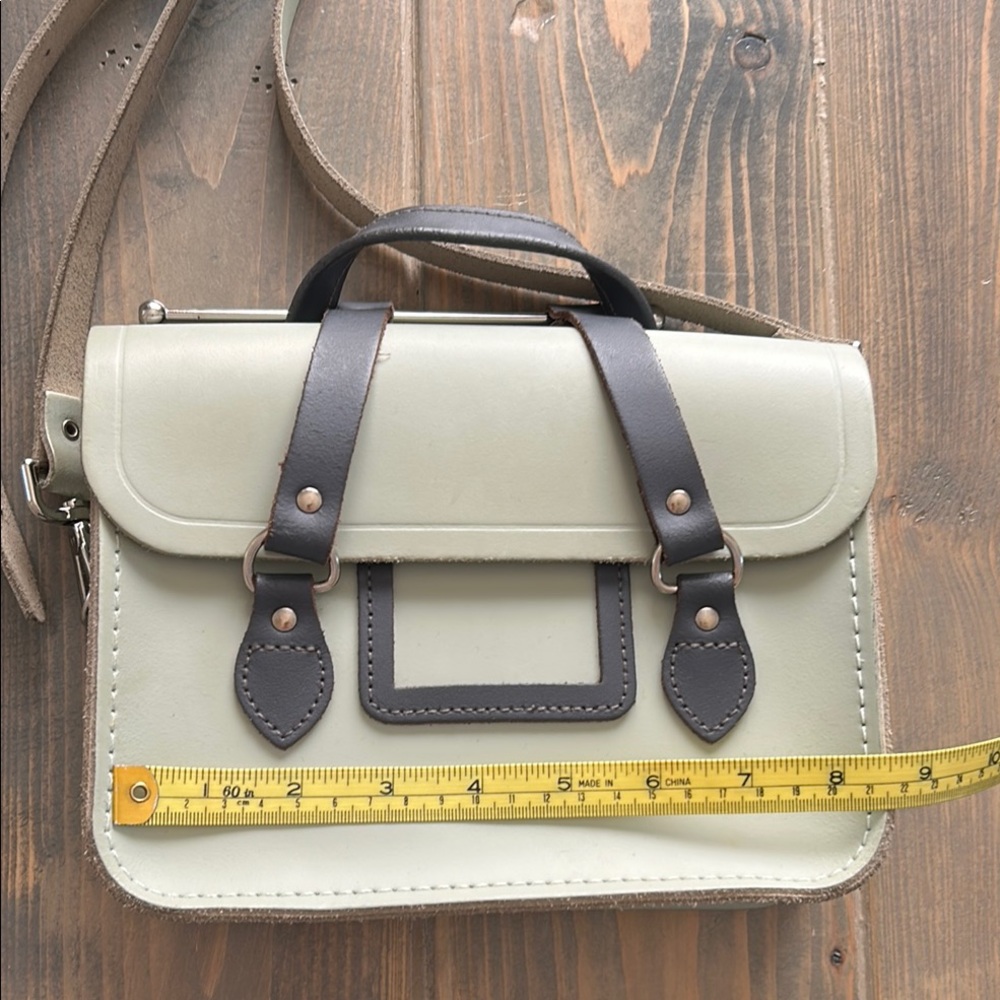 Pale green thick leather handbag with unusual handles
